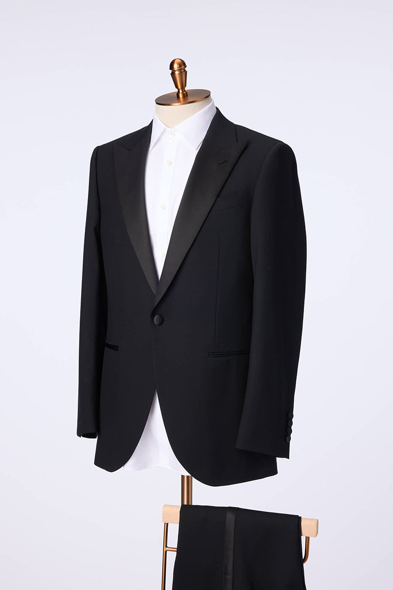 Custom black tuxedo with peak lapel in premium fabric