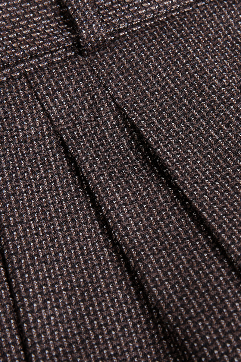 Custom waistband and pleats on tailored brown jacquard trousers
