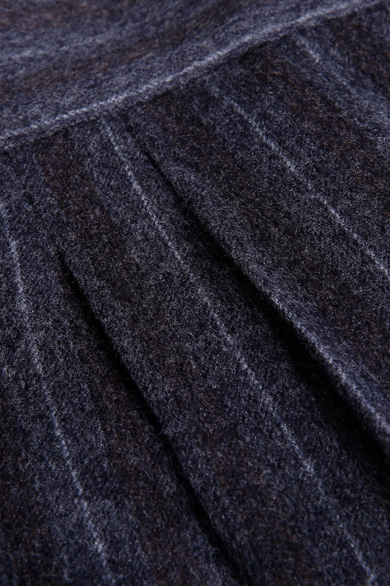 Custom waistband and pleats on tailored grey pinstripe trousers