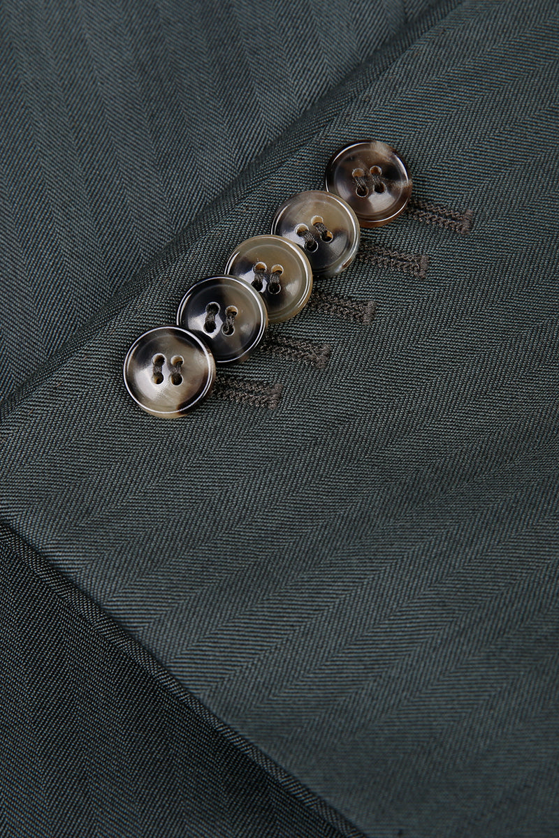 Custom sleeve buttons on tailored forest green herringbone suit