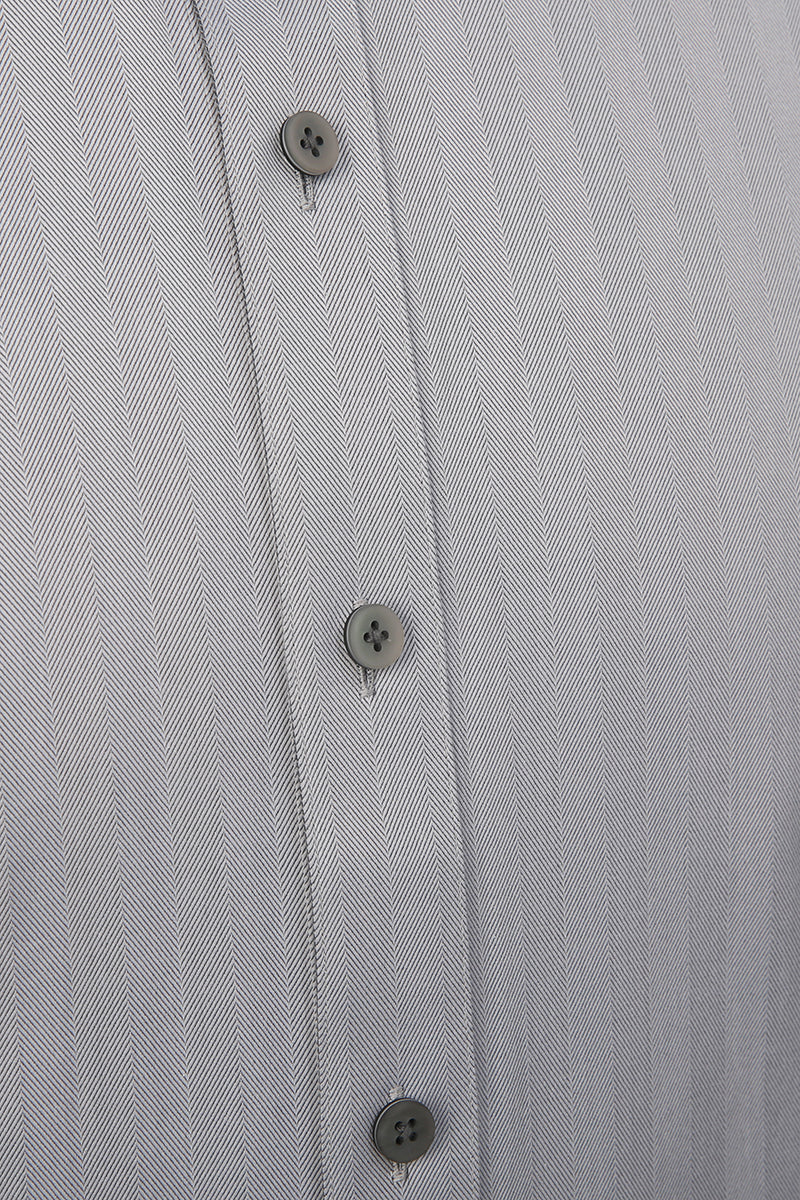 Luxury herringbone fabric texture on bespoke grey dress shir