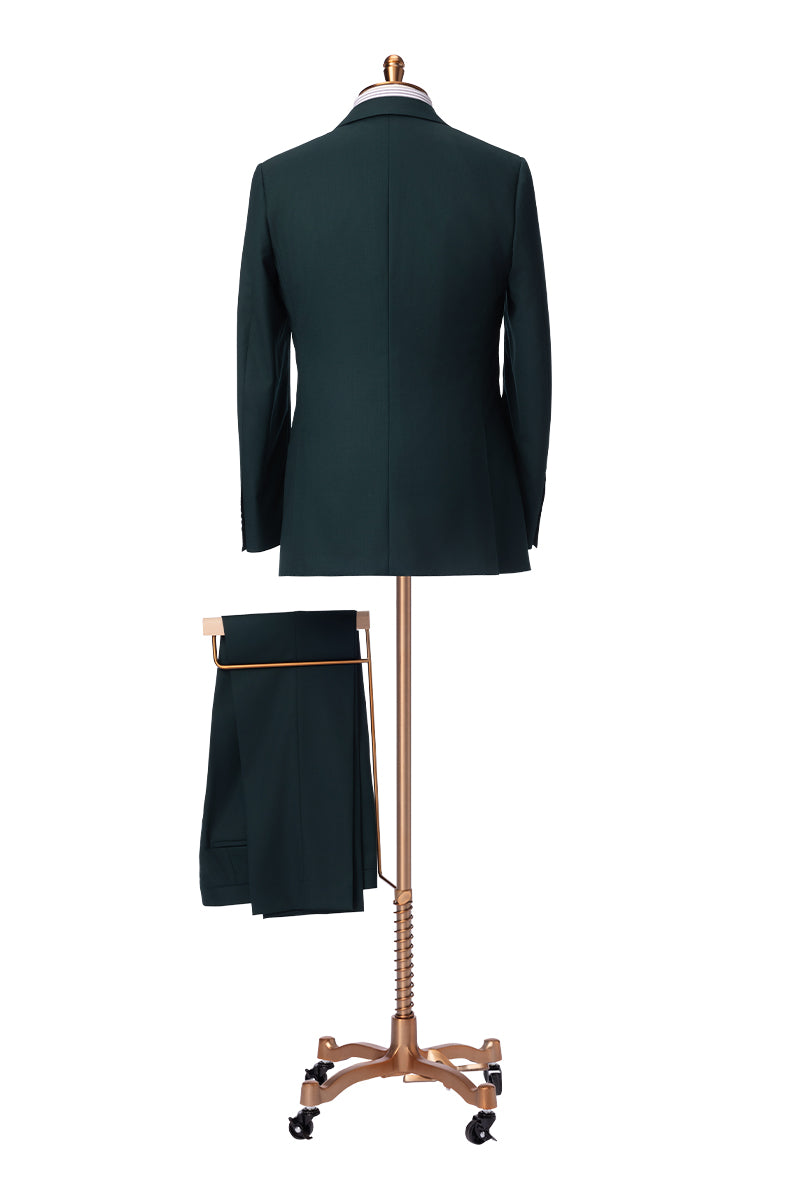 Hunter green suit styled for wedding or business attire