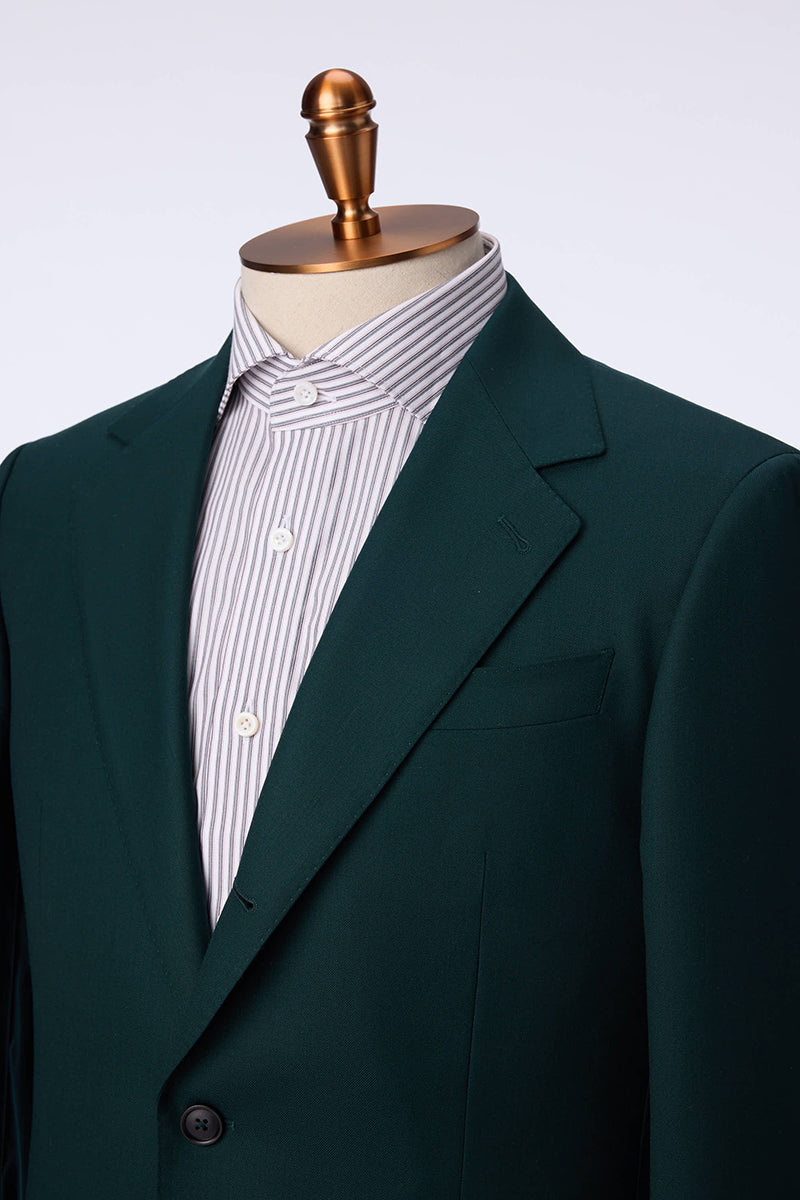 Custom lapel and buttons on tailored hunter green suit