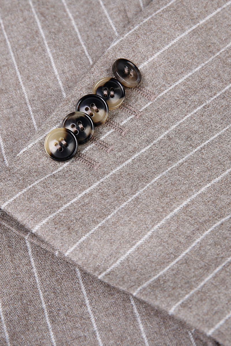Custom sleeve buttons on tailored tan pinstripe suit