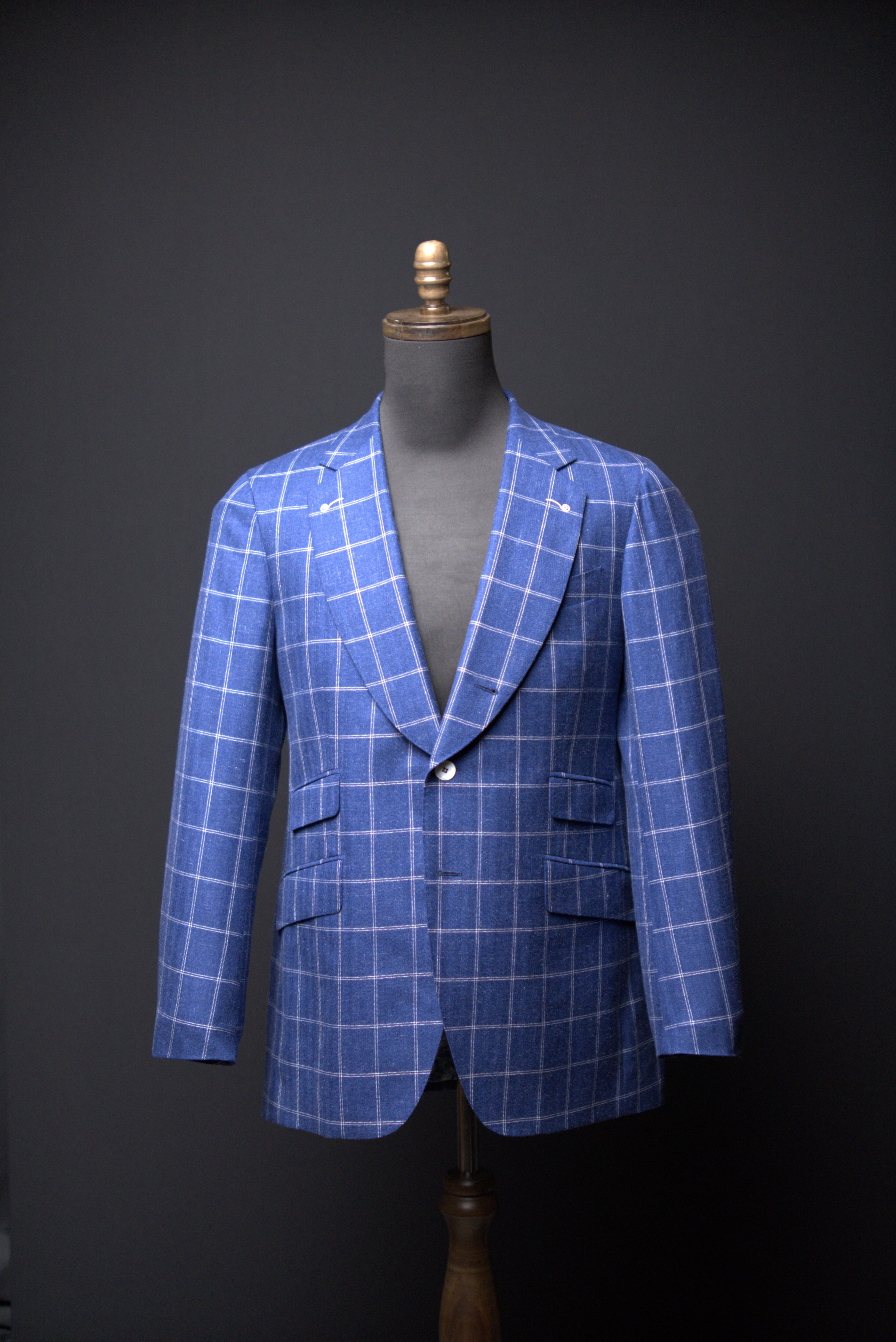 Royal blue windowpane with violet overcheck · single-breasted · two-button · peak lapel · ticket pocket