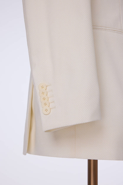 Custom sleeve buttons on tailored ivory tuxedo