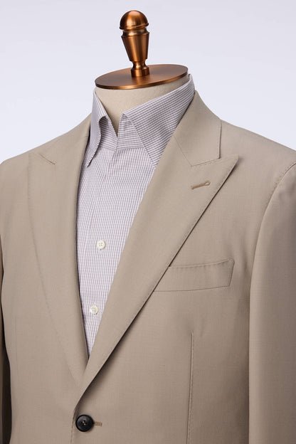 Custom lapel and buttons on tailored khaki wool suit