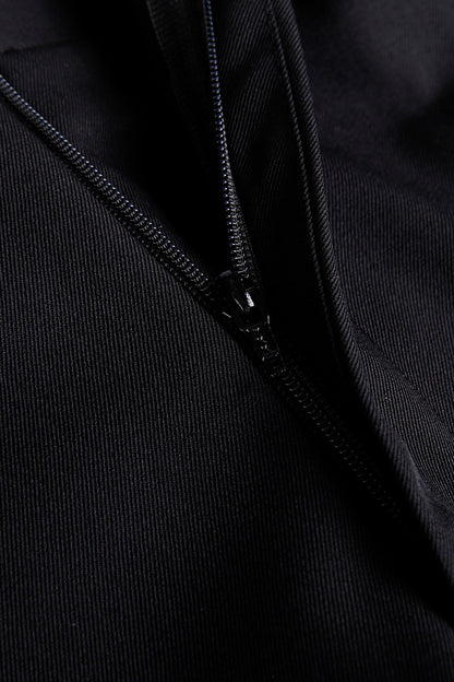 “Luxury black wool fabric texture and custom zipper on bespoke men’s dress pants