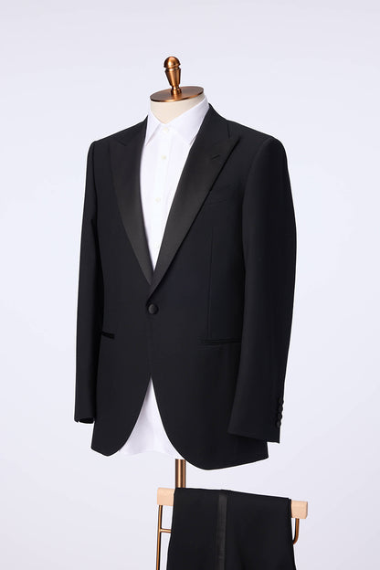 Custom black tuxedo with peak lapel in premium fabric