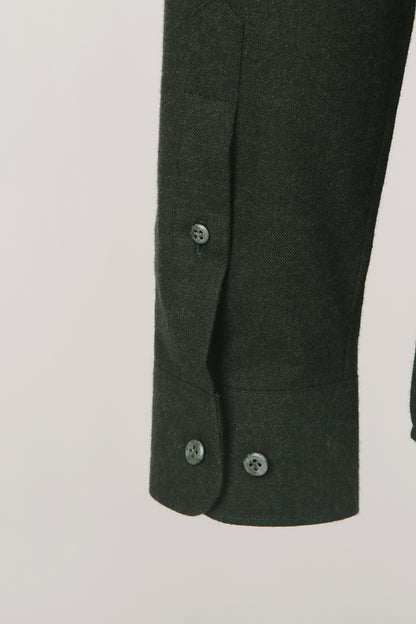 Custom sleeve buttons on tailored dark green shirt