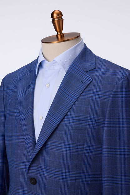Custom lapel and buttons on tailored blue plaid suit