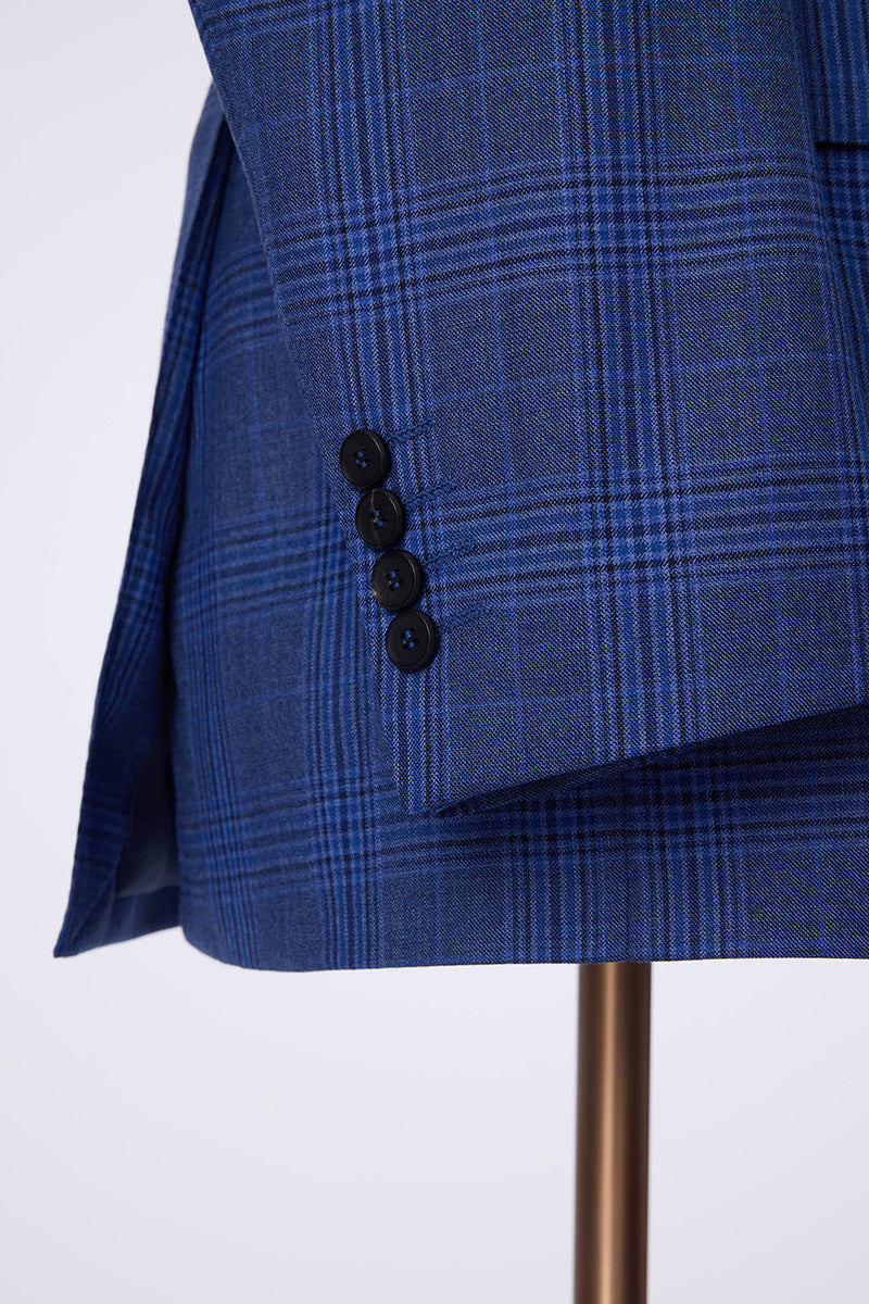 Custom sleeve buttons on tailored blue plaid suit