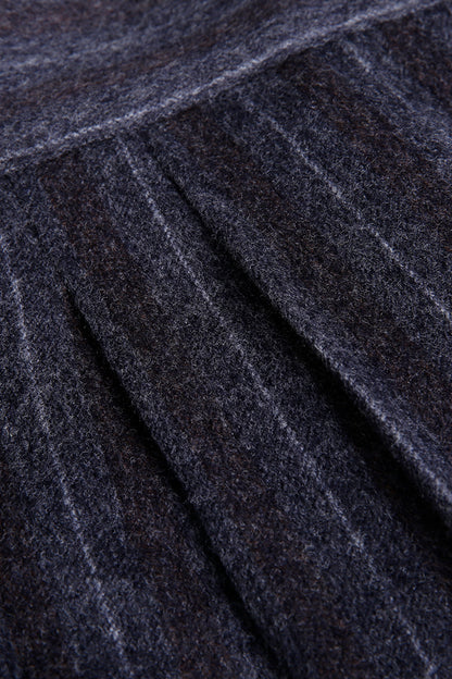 Custom waistband and pleats on tailored grey pinstripe trousers