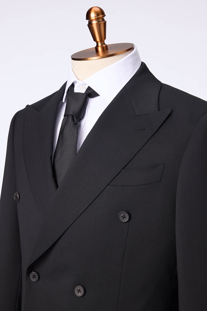 Custom lapel and buttons on tailored double-breasted black suit