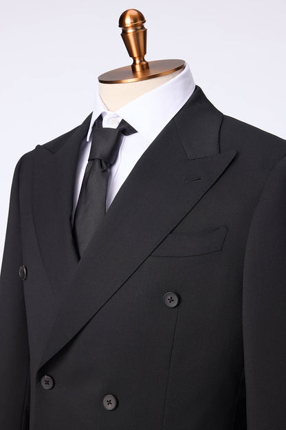 Custom lapel and buttons on tailored double-breasted black suit