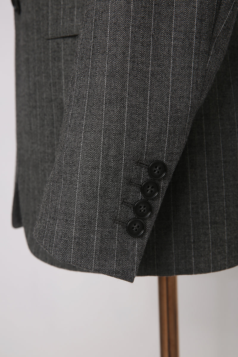 Custom sleeve buttons on tailored grey herringbone blaze