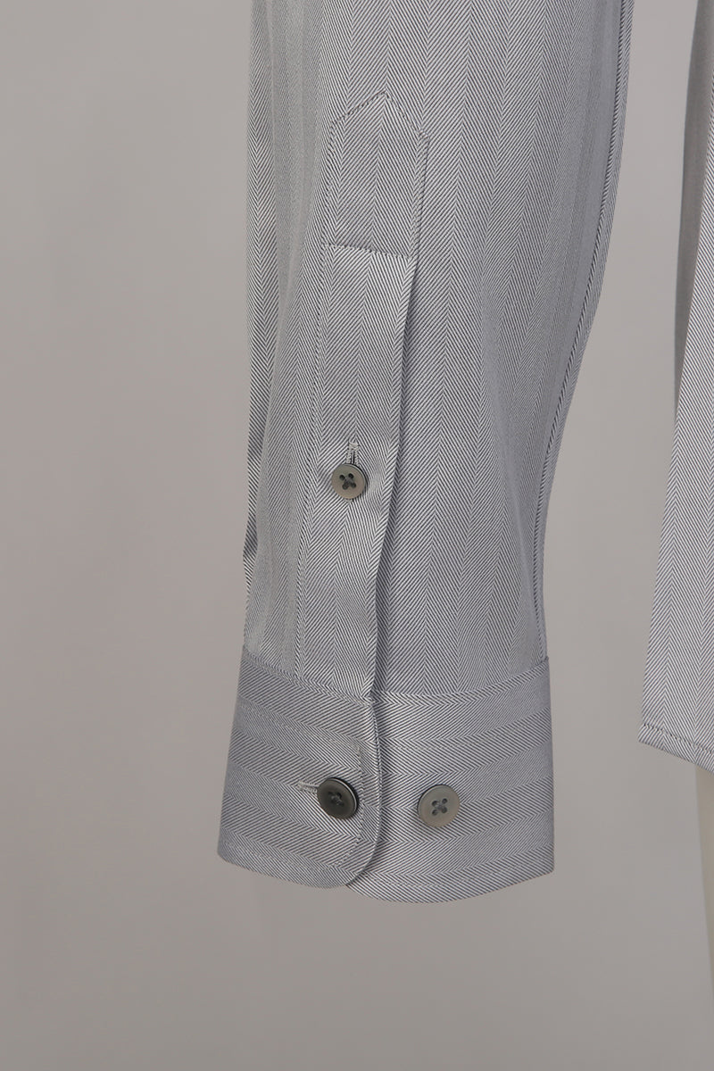 Custom sleeve buttons on tailored grey herringbone shirt