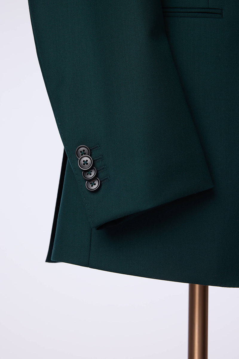 Custom sleeve buttons on tailored hunter green suit