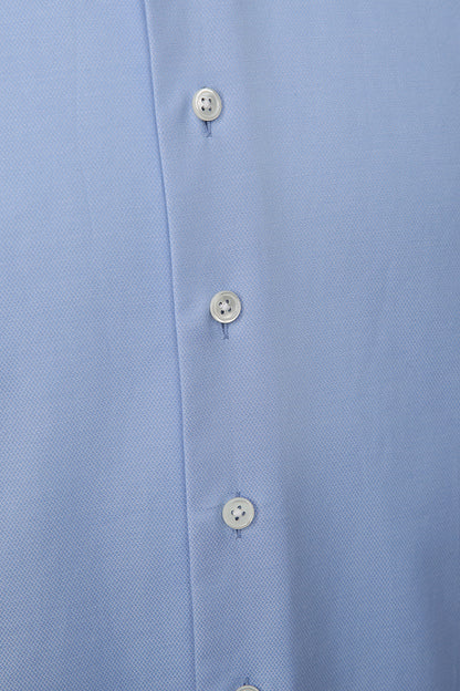 Luxury light blue cotton fabric texture on bespoke shirt