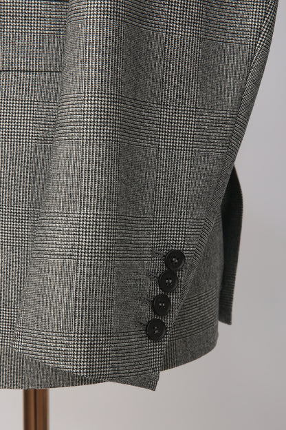 Custom sleeve buttons on tailored grey check Prince of Wales blazer