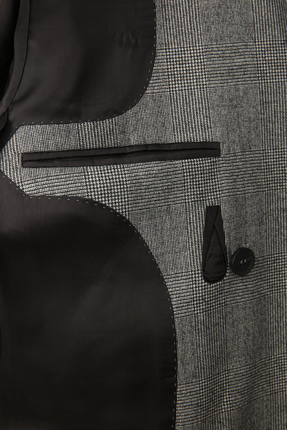 Luxury grey check fabric texture and lining on the inside of the bespoke Prince of Wales blazer