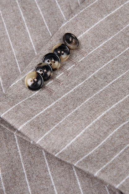 Custom sleeve buttons on tailored tan pinstripe suit