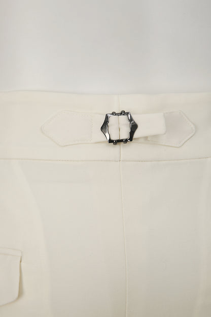 Custom waist adjuster on tailored white trousers