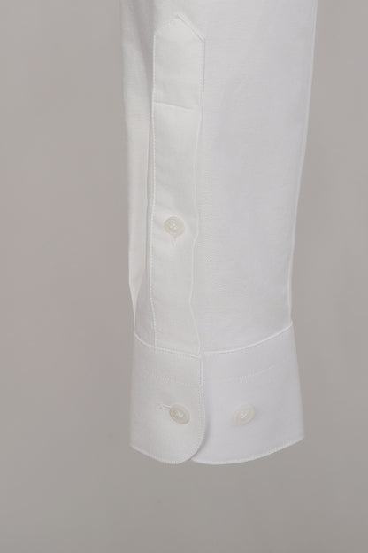 Luxury cotton fabric texture on bespoke white shirt sleeve